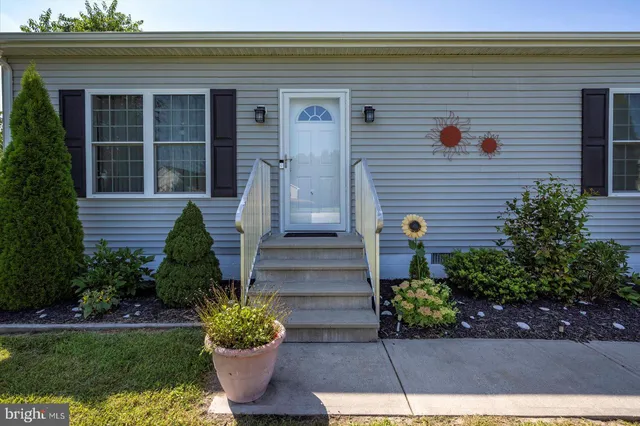 a view of two chairs in the balcony