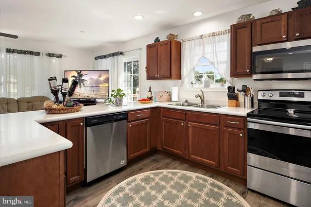 a bathroom with a double vanity sink toilet and shower