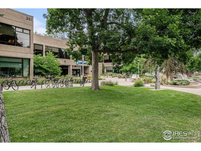 a view of a house with backyard and a patio