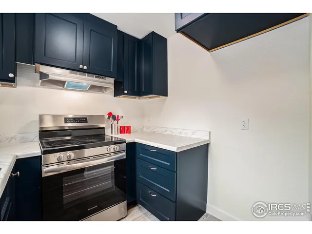 a kitchen with cabinets and appliances