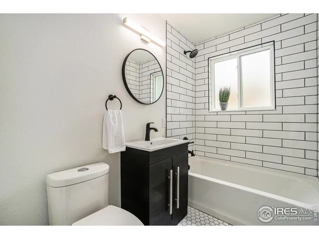 a bathroom with a sink a toilet and a bathtub