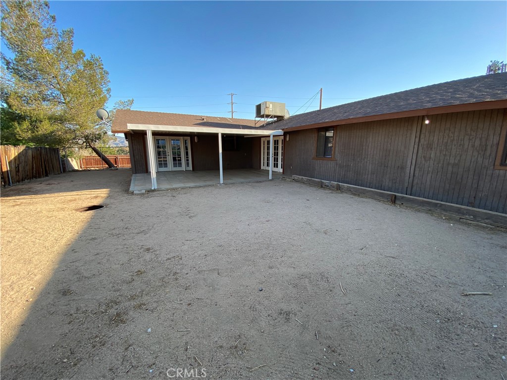 18746 Rock Springs Road Hesperia, CA 92345 - Photo 21 of 21 a view of a house with a backyard and balcony