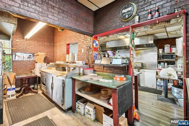 a dining room with furniture and a window