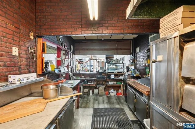 a view of a chairs and table in the balcony