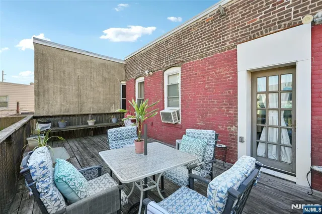 a dinning table and chairs in a patio