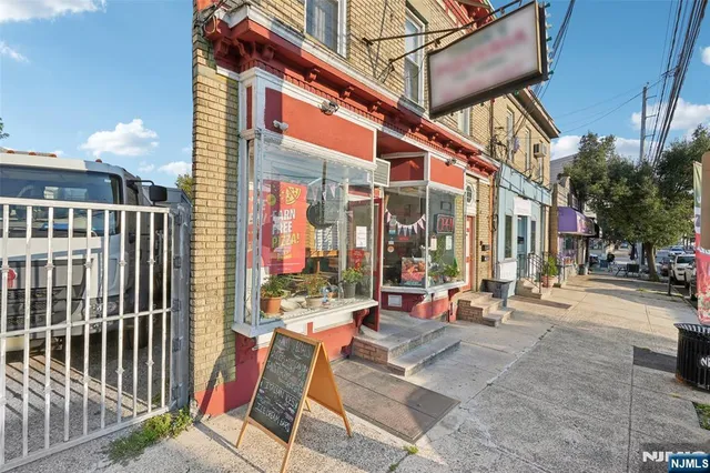 a view of a building with sitting area