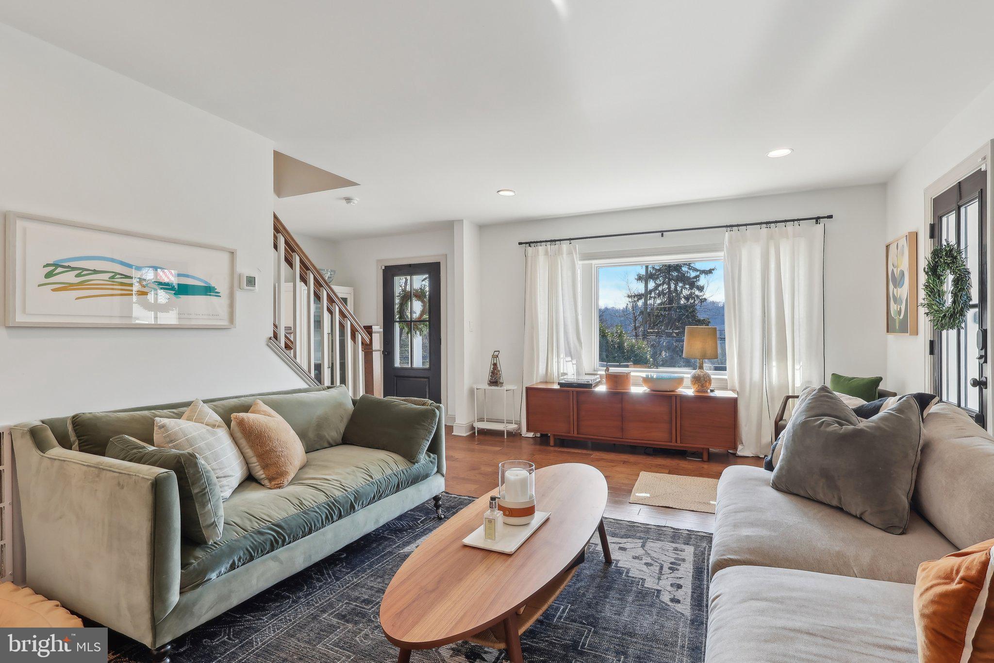 206 Upper Gulph Road Radnor, PA 19087 - Photo 17 of 36 a living room with furniture and a large window