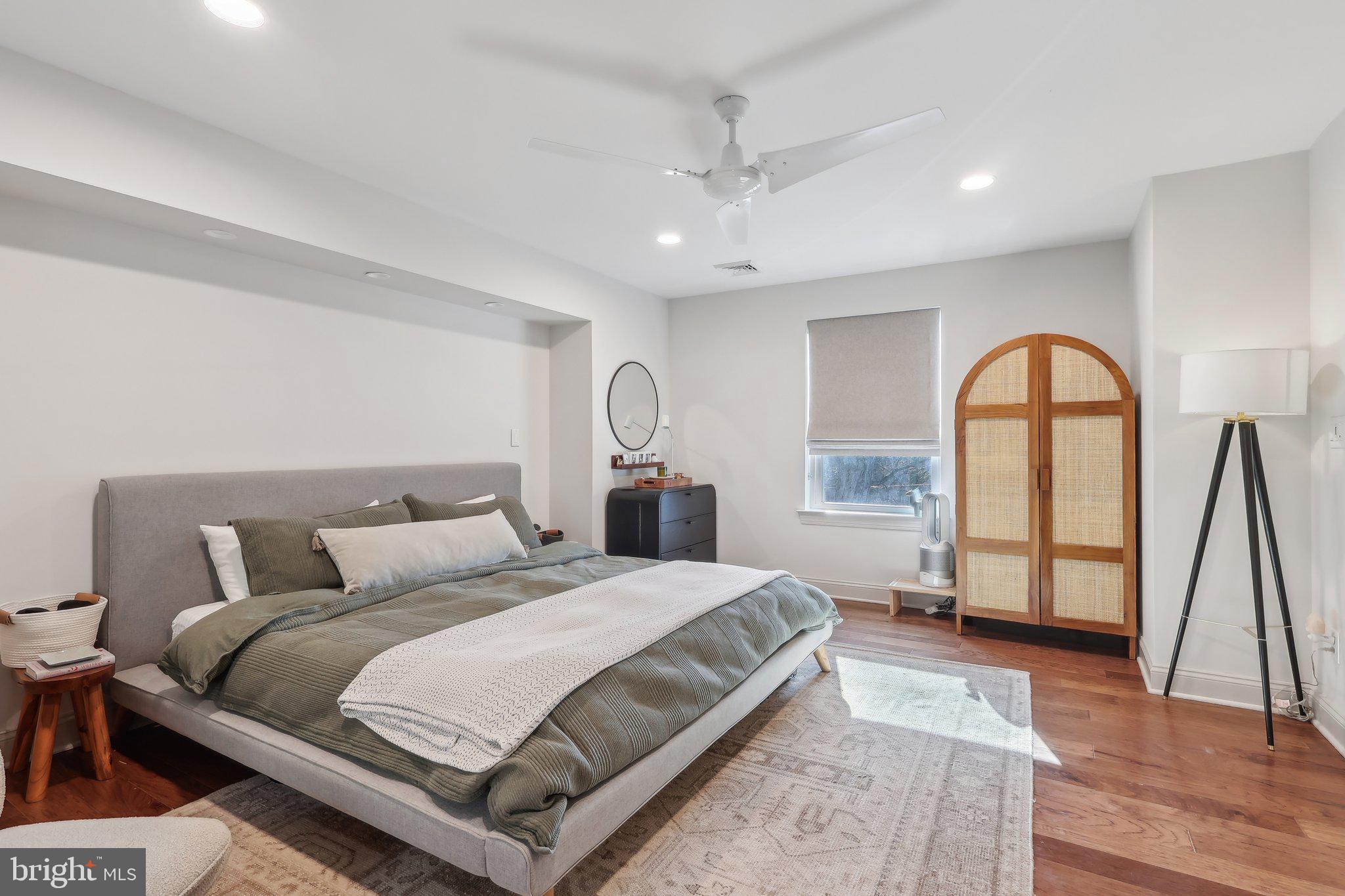 206 Upper Gulph Road Radnor, PA 19087 - Photo 24 of 36 a bedroom with a large bed and a wooden floor