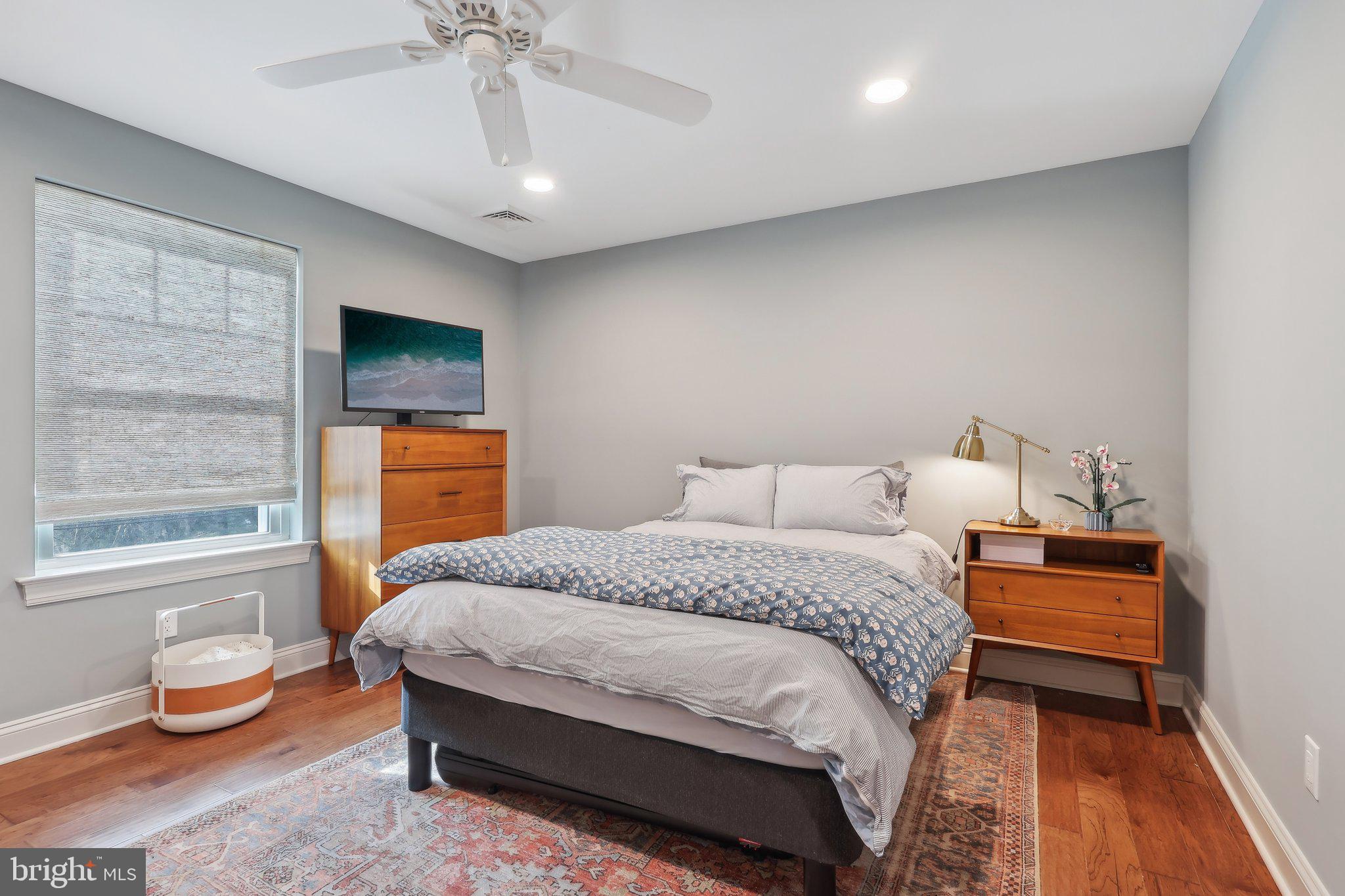 206 Upper Gulph Road Radnor, PA 19087 - Photo 27 of 36 a bedroom with a bed and a chandelier