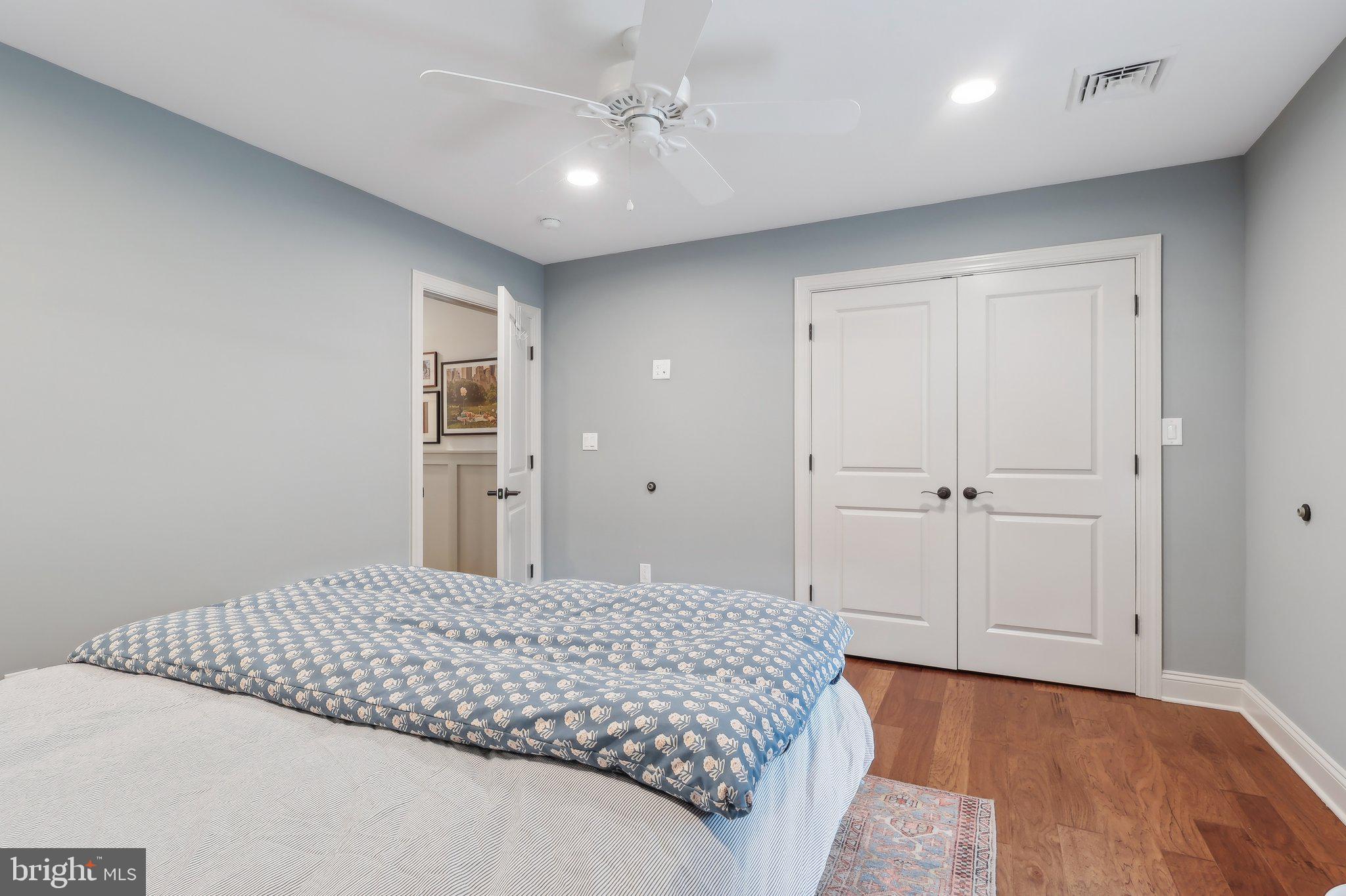 206 Upper Gulph Road Radnor, PA 19087 - Photo 28 of 36 a bedroom with a bed and a chandelier