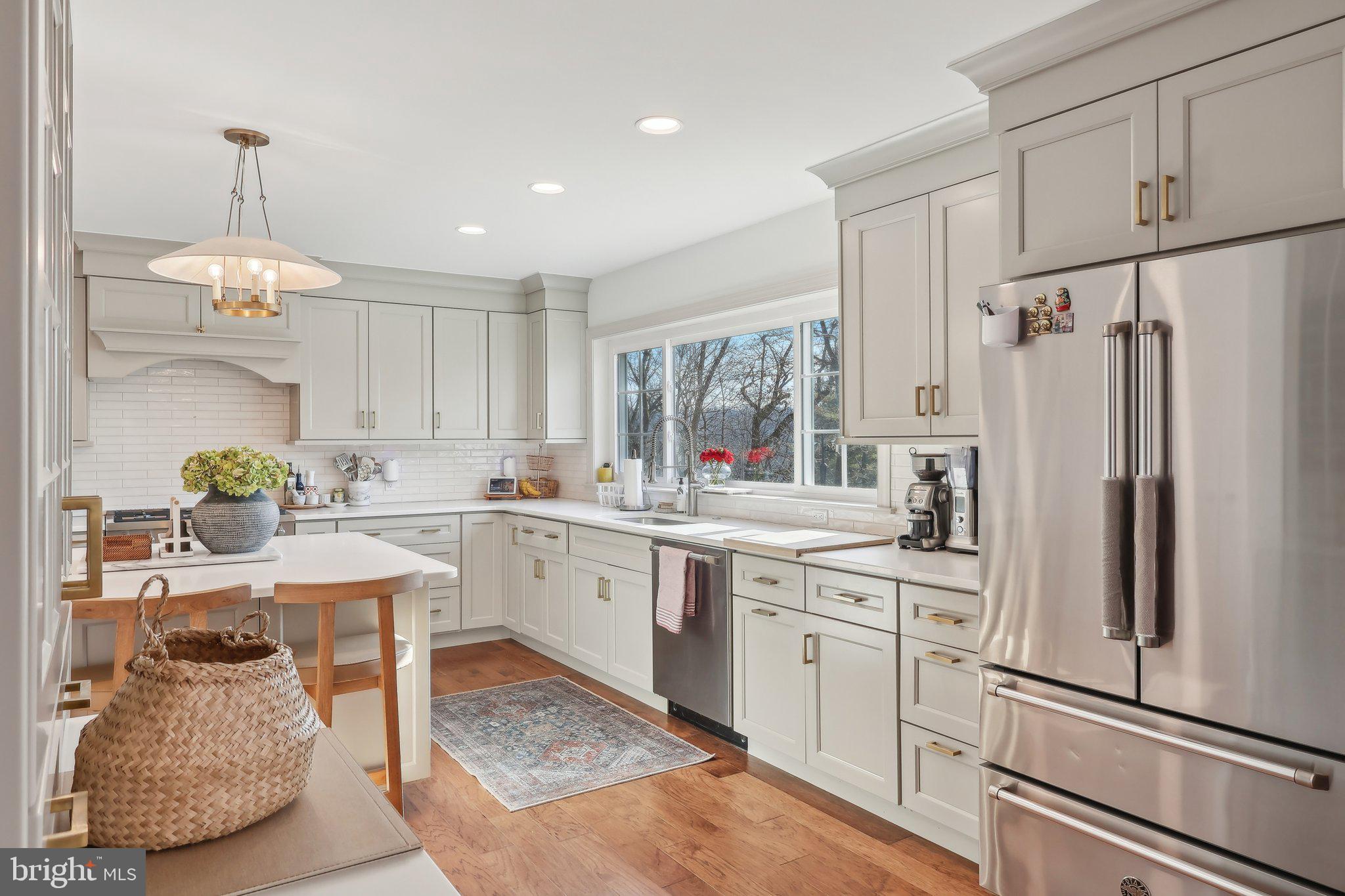206 Upper Gulph Road Radnor, PA 19087 - Photo 8 of 36 a kitchen with white cabinets and refrigerator