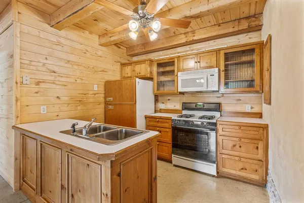 a kitchen with a stove and a microwave