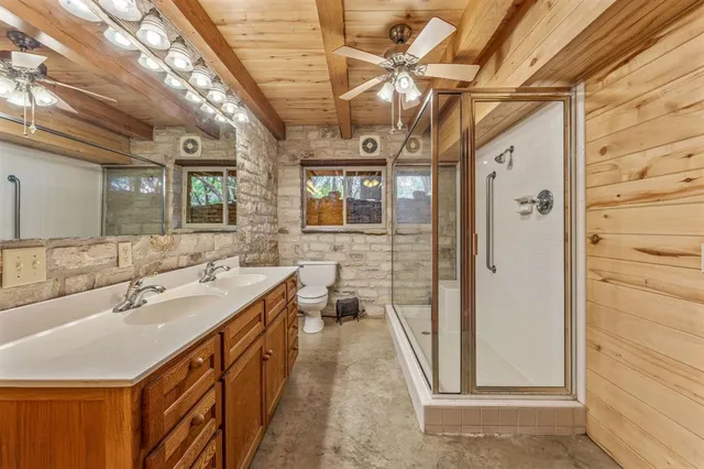 a bathroom with a double vanity sink and a mirror