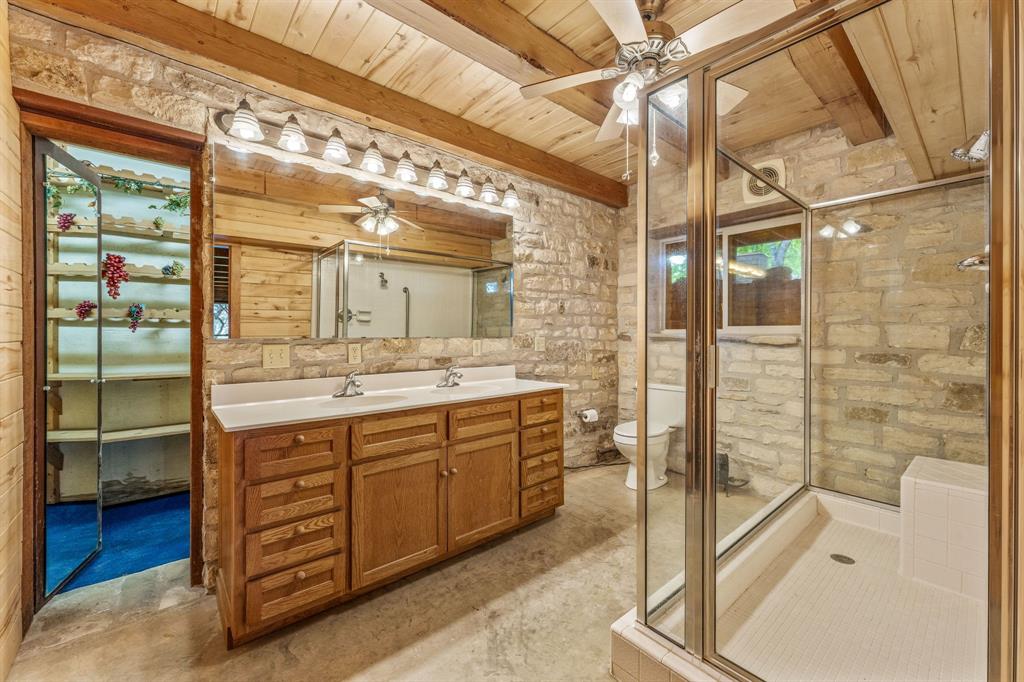 5905 North Us Highway Hamilton, TX 76531 - Photo 28 of 40 a bathroom with a double vanity sink and a mirror