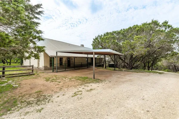 a house with trees in the background