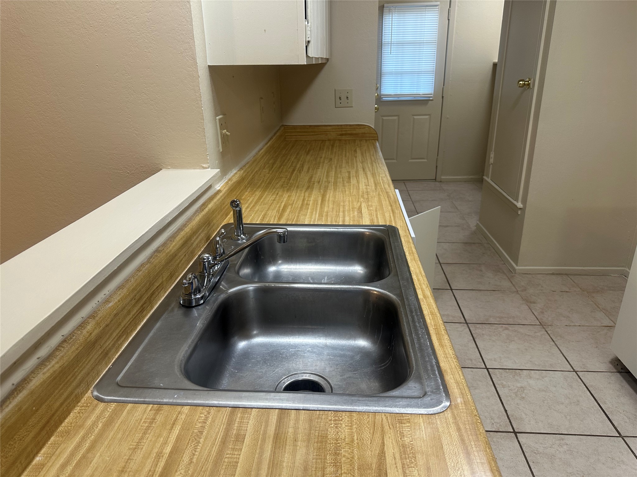 2602 South Bagdad Road, Unit A Leander, TX 78641 - Photo 22 of 26 A well-appointed kitchen features a double basin sink, providing both style and utility.
