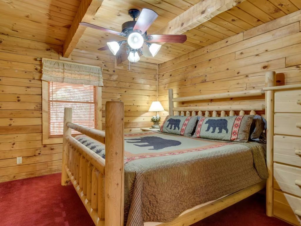 1634 Ridgecrest Drive Sevierville, TN 37876 - Photo 7 of 18 a bedroom with a bed and a mirror on the dresser