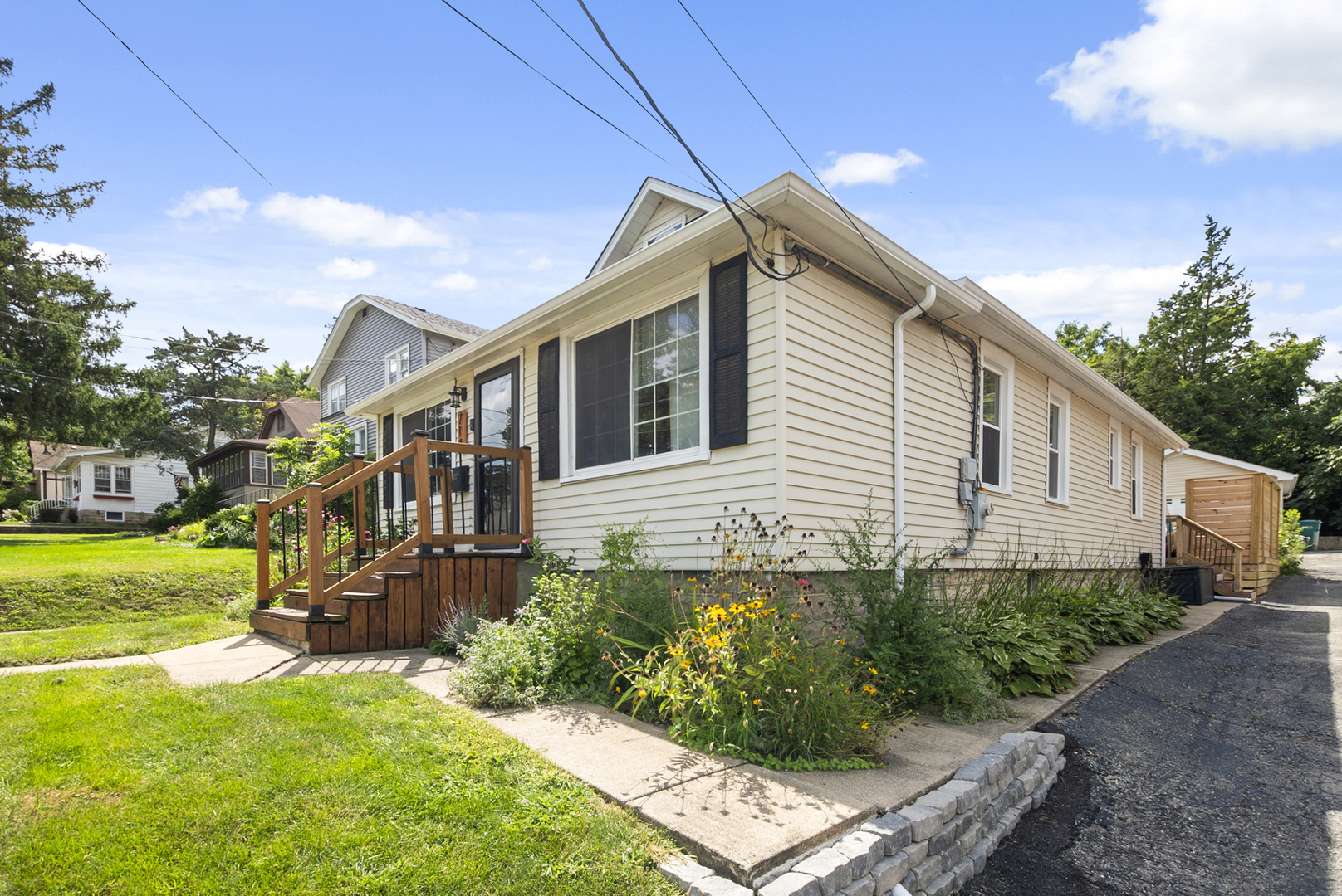 714 Walnut Street Lemont, IL 60439 - Photo 1 of 25 a front view of a house with garden