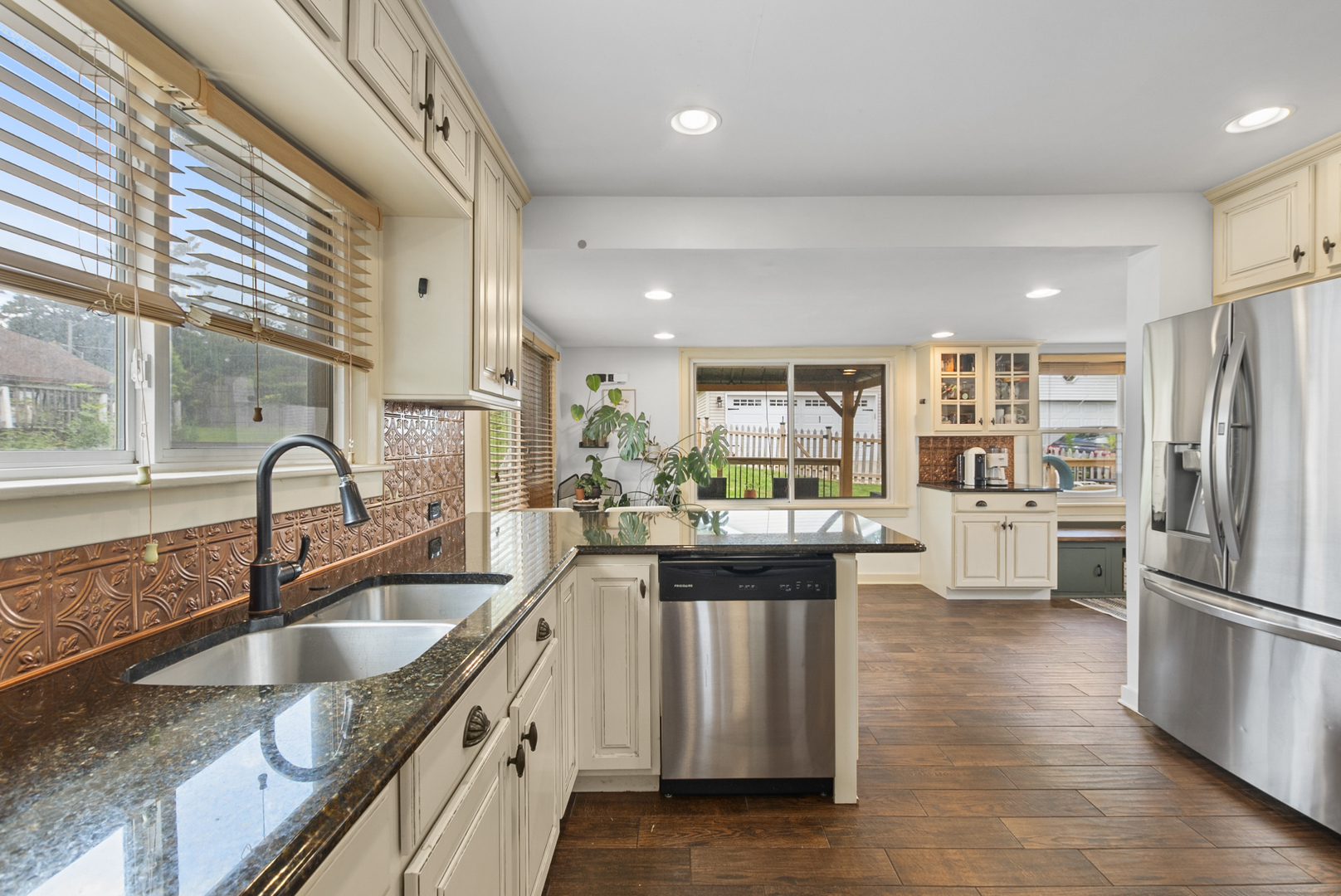 714 Walnut Street Lemont, IL 60439 - Photo 11 of 25 a kitchen with stainless steel appliances granite countertop a sink stove and refrigerator