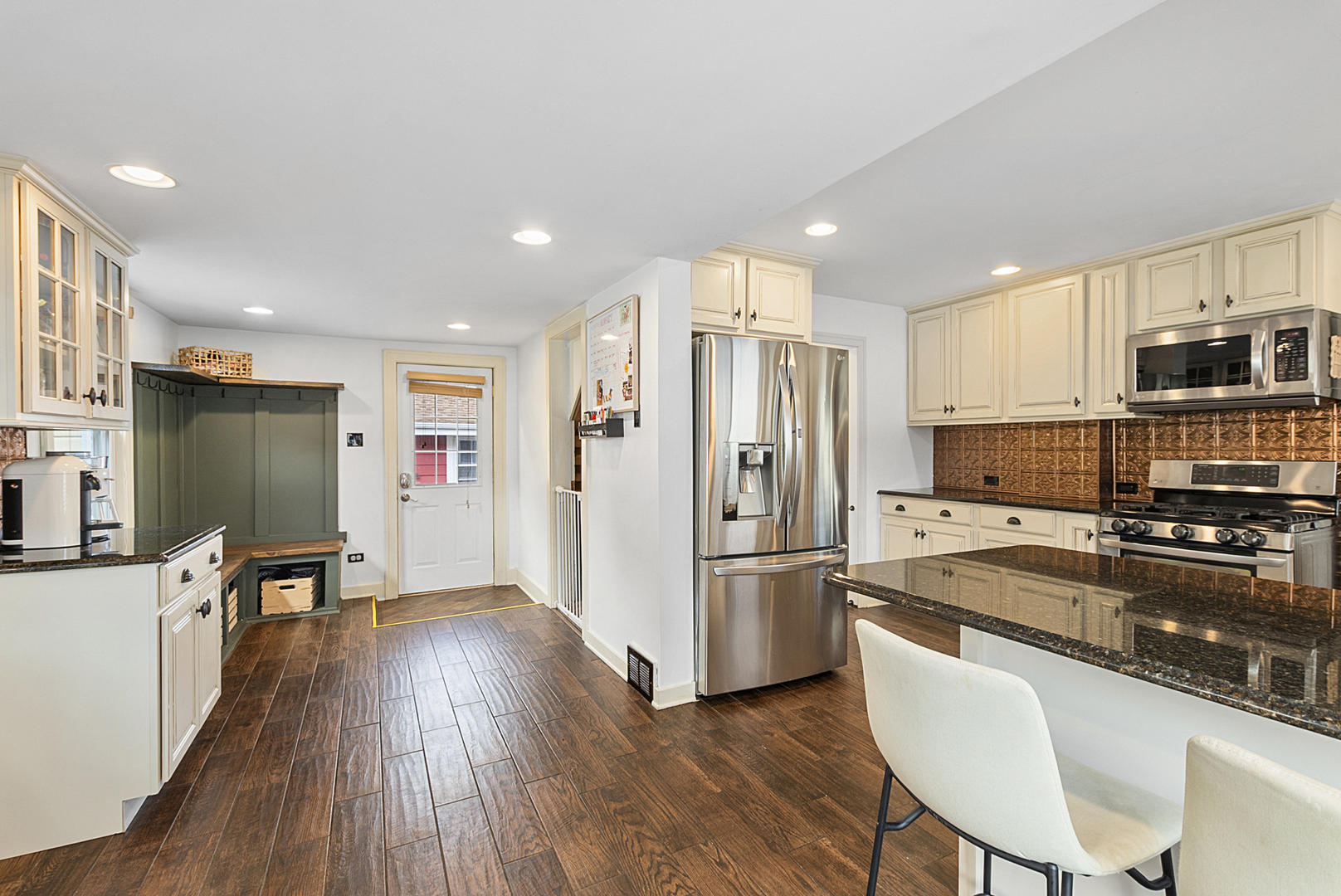 714 Walnut Street Lemont, IL 60439 - Photo 15 of 25 a kitchen with granite countertop a refrigerator stove microwave and wooden floor