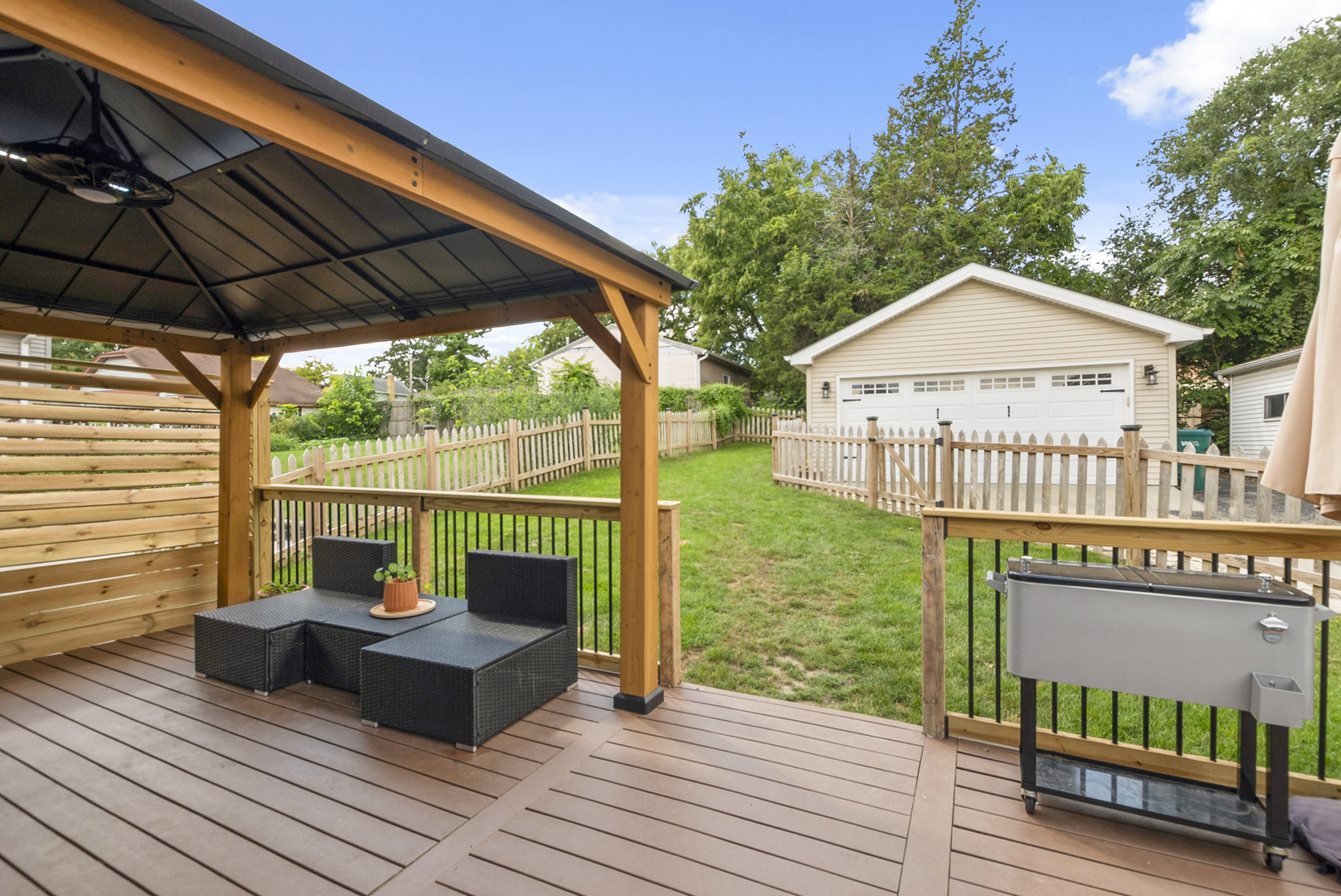 714 Walnut Street Lemont, IL 60439 - Photo 23 of 25 a view of a deck with wooden floor and outdoor seating