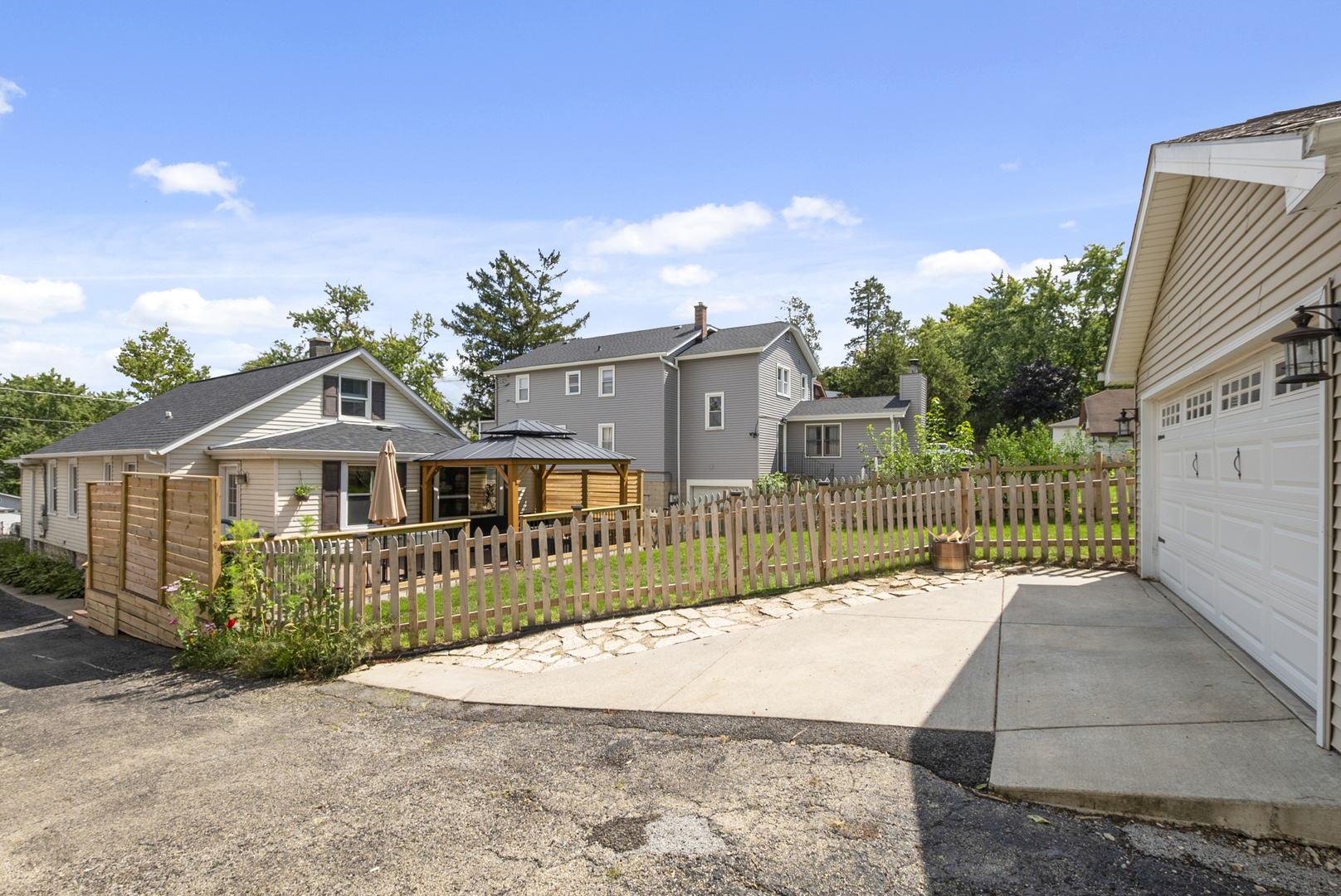 714 Walnut Street Lemont, IL 60439 - Photo 24 of 25 a view of a house with a small yard and plants