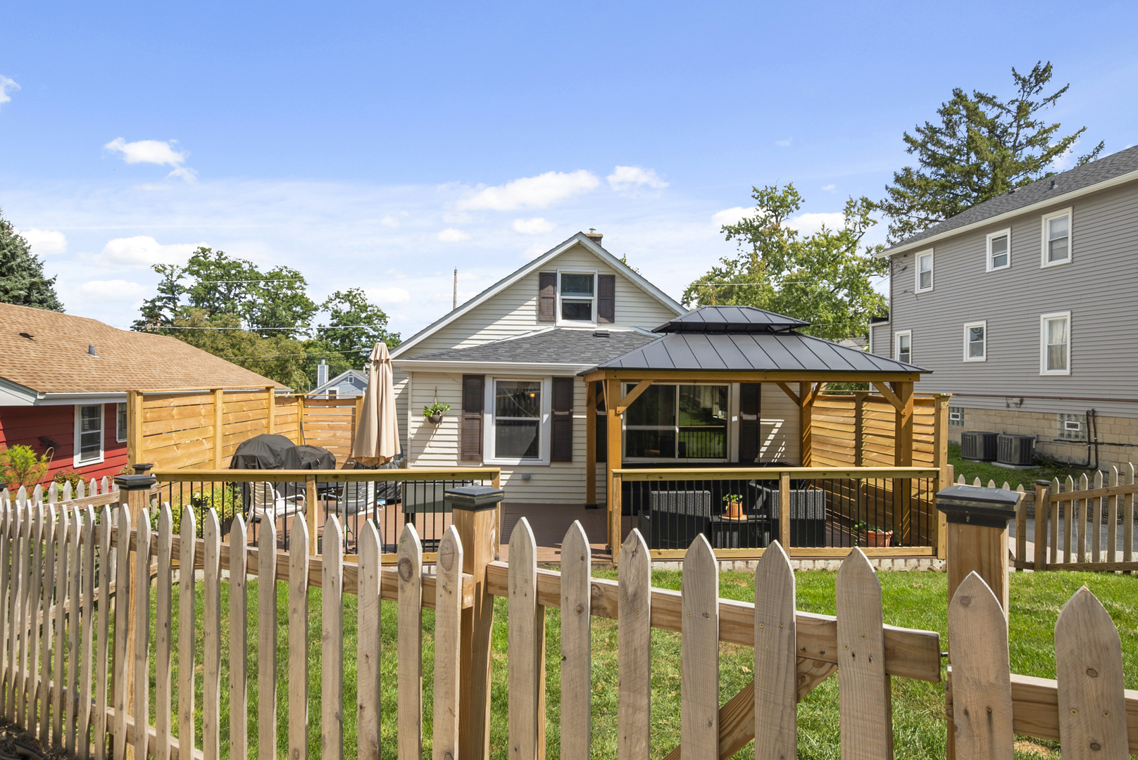 714 Walnut Street Lemont, IL 60439 - Photo 25 of 25 a front view of a house with wooden fence