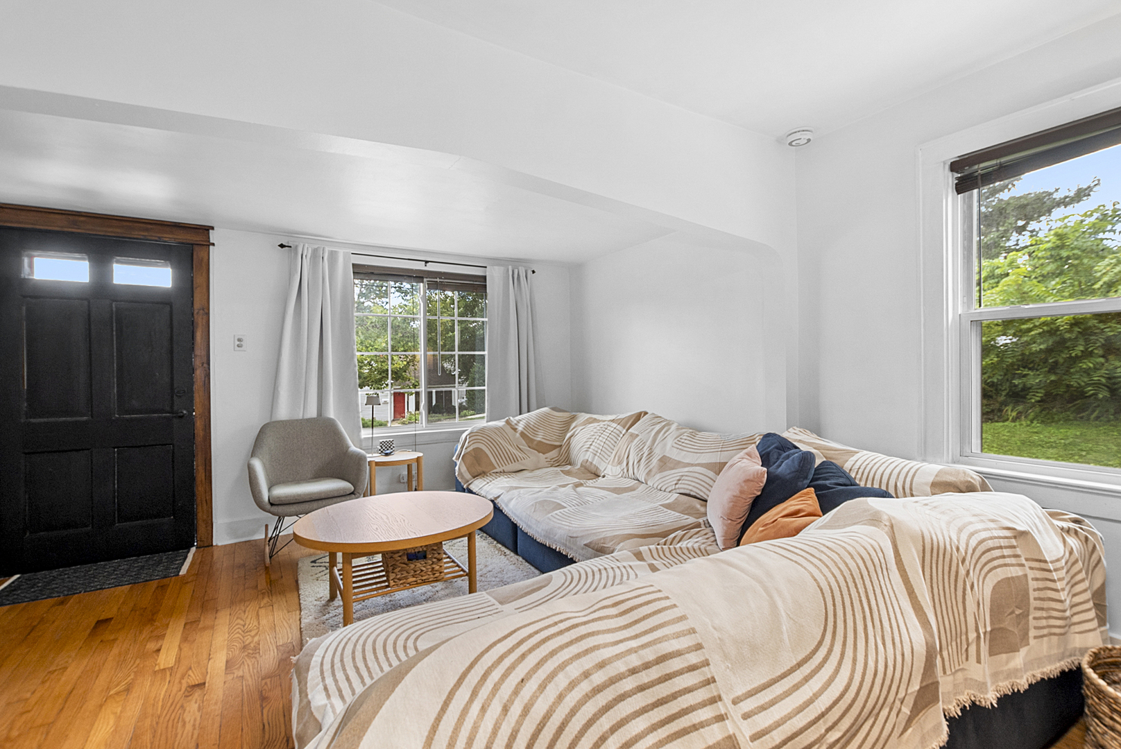 714 Walnut Street Lemont, IL 60439 - Photo 5 of 25 a bedroom with two beds and a large window