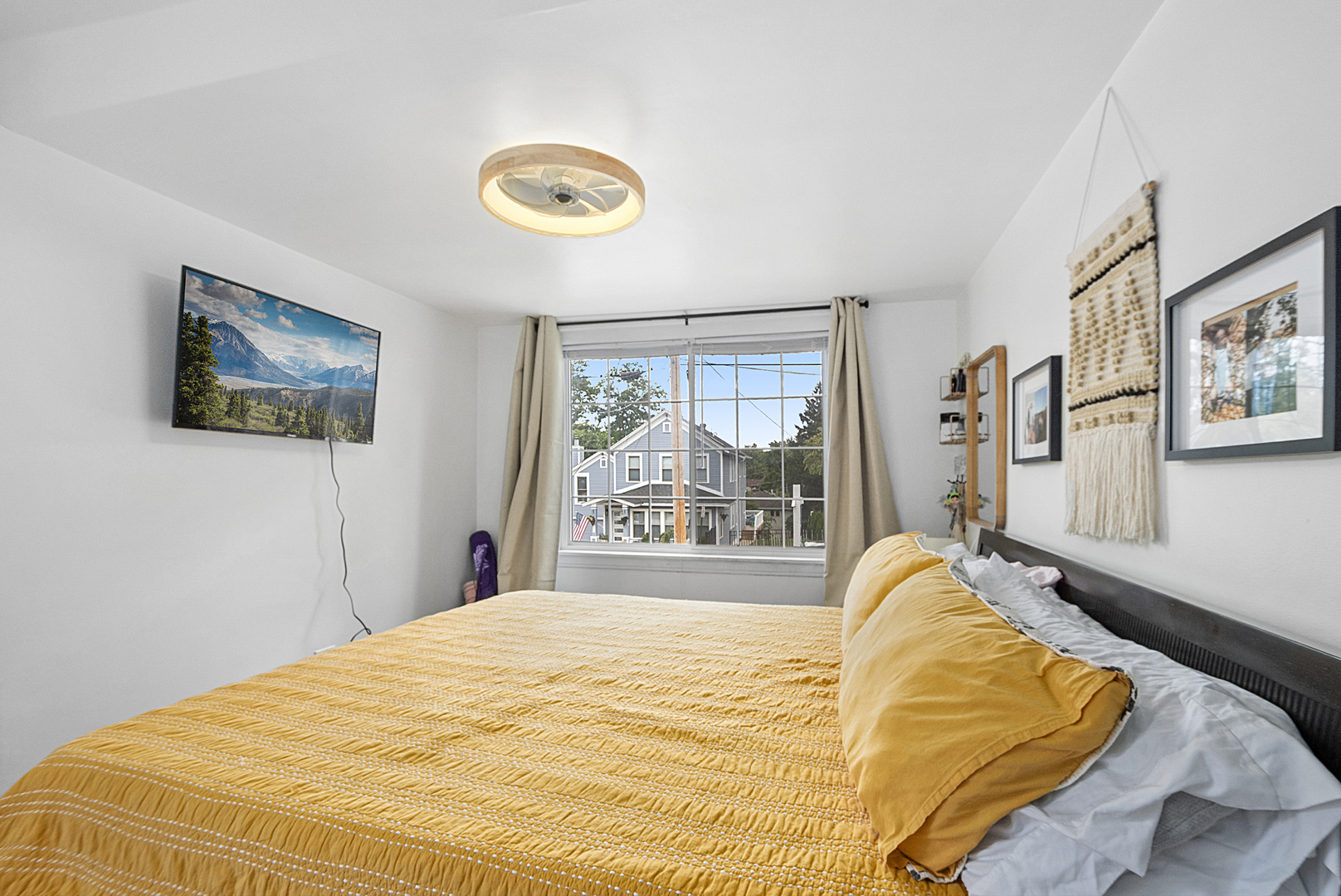 714 Walnut Street Lemont, IL 60439 - Photo 7 of 25 a bed sitting in a bedroom next to a window