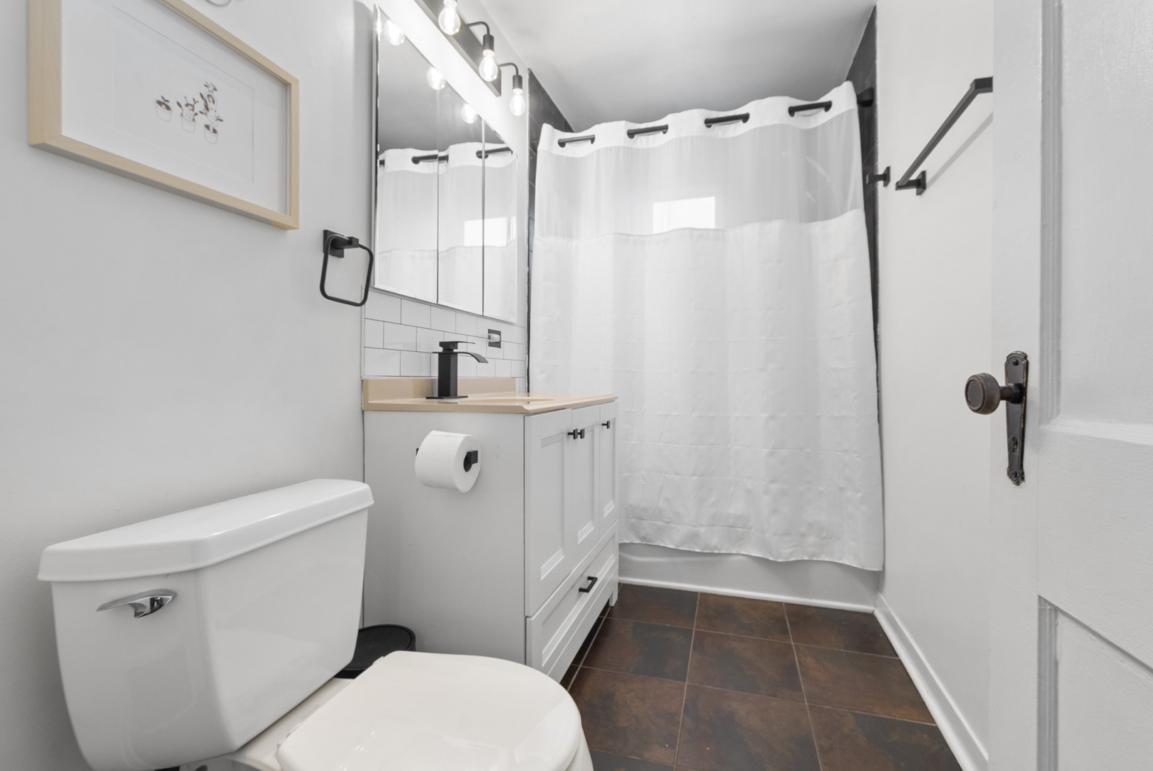 714 Walnut Street Lemont, IL 60439 - Photo 10 of 25 a white toilet sitting next to a bathroom sink