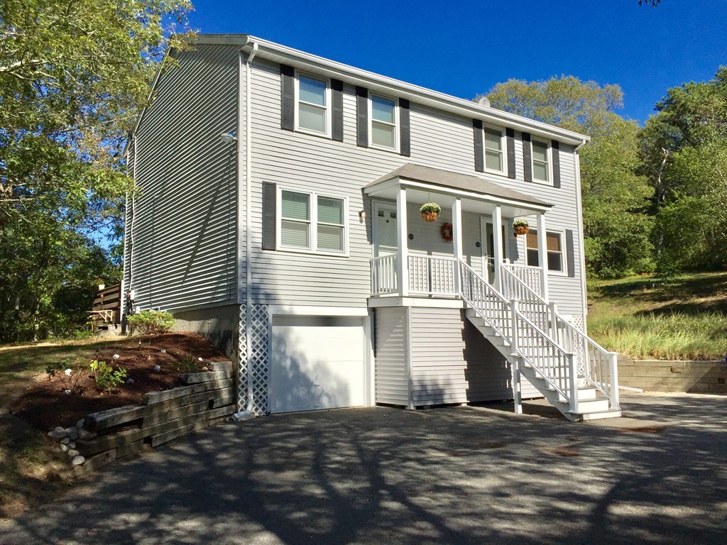 30 Standish Road, Unit 1 & 2 Bourne, MA 02562 - Photo 2 of 30 a front view of a house with a yard
