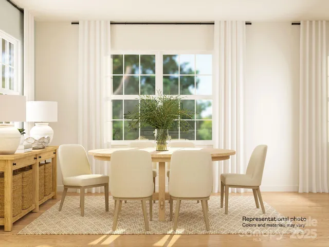 a white toilet sitting next to a white wall