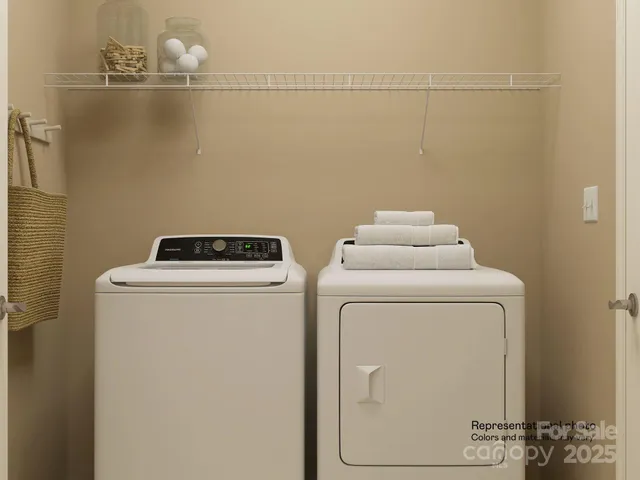 a living room with furniture and a lamp