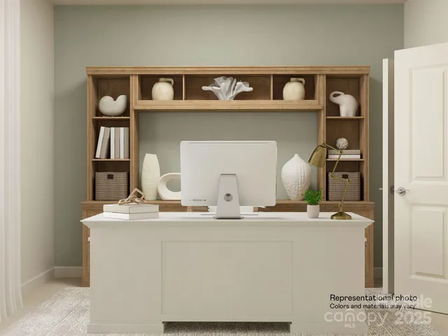 a kitchen with granite countertop white cabinets and stainless steel appliances