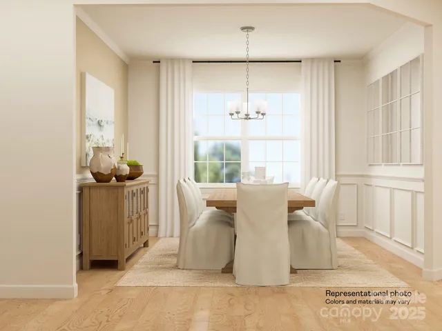 a dining room with furniture and a window