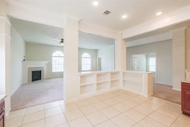 a view of empty room with a fireplace