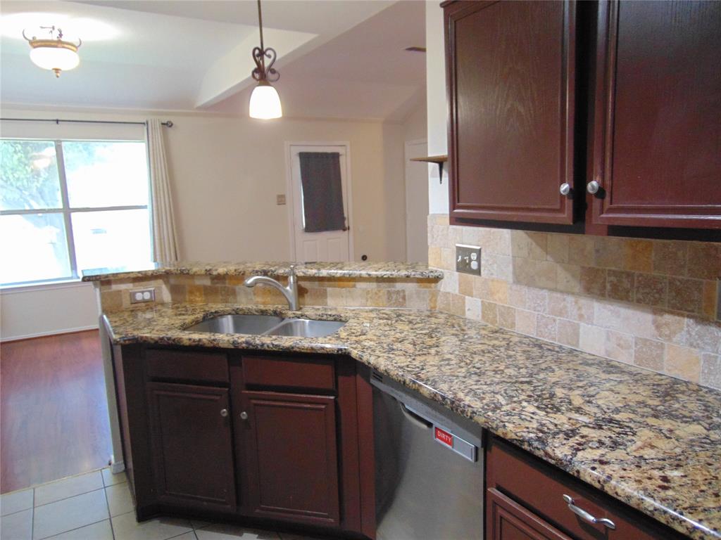 1425 Sunny Meadow Road Lancaster, TX 75134 - Photo 11 of 22 a bathroom with a granite countertop sink and a mirror