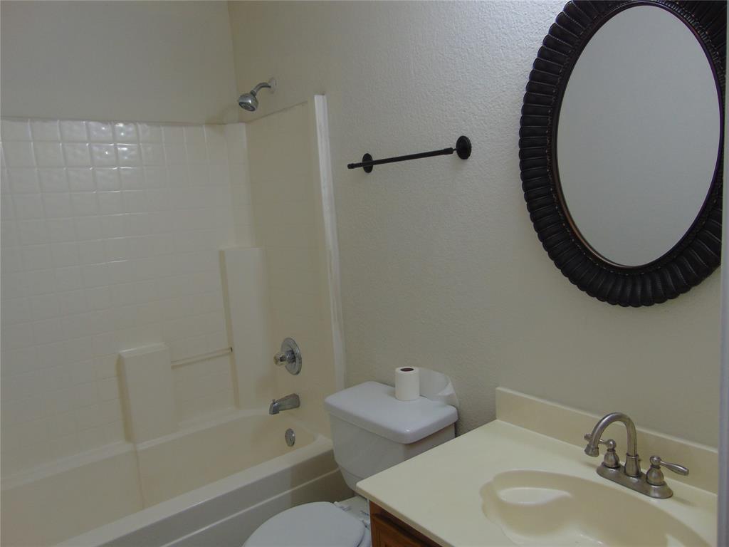 1425 Sunny Meadow Road Lancaster, TX 75134 - Photo 18 of 22 a bathroom with a sink and a mirror