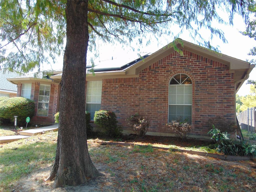1425 Sunny Meadow Road Lancaster, TX 75134 - Photo 4 of 22 a front view of a house with a yard