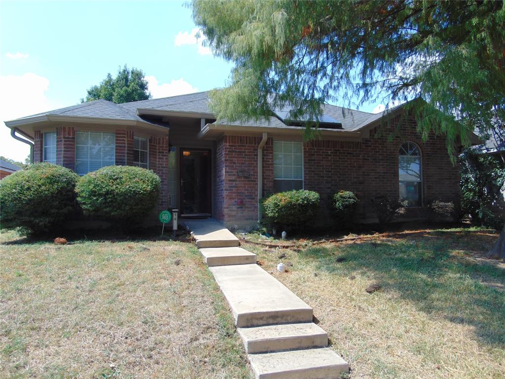 1425 Sunny Meadow Road Lancaster, TX 75134 - Photo 6 of 22 a view of a house with a yard and large trees
