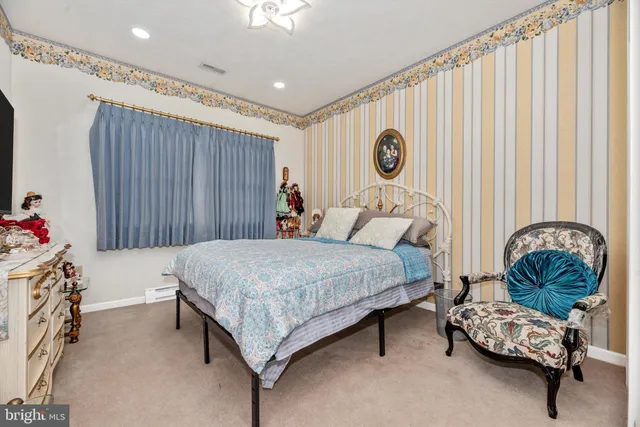 a bed room with a bed and a chandelier