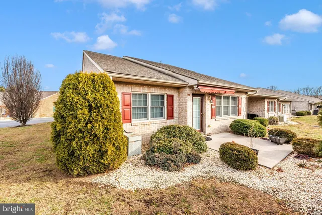 a front view of a house with a porch