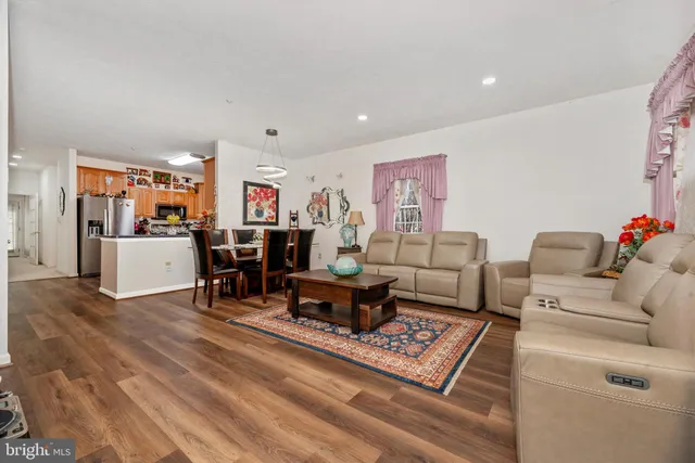 a living room with furniture and a table