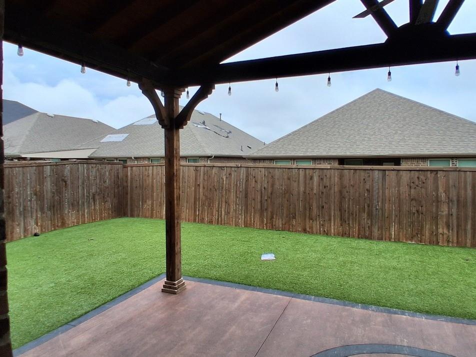 141 Colony Way Fate, TX 75189 - Photo 16 of 20 a view of backyard with tub