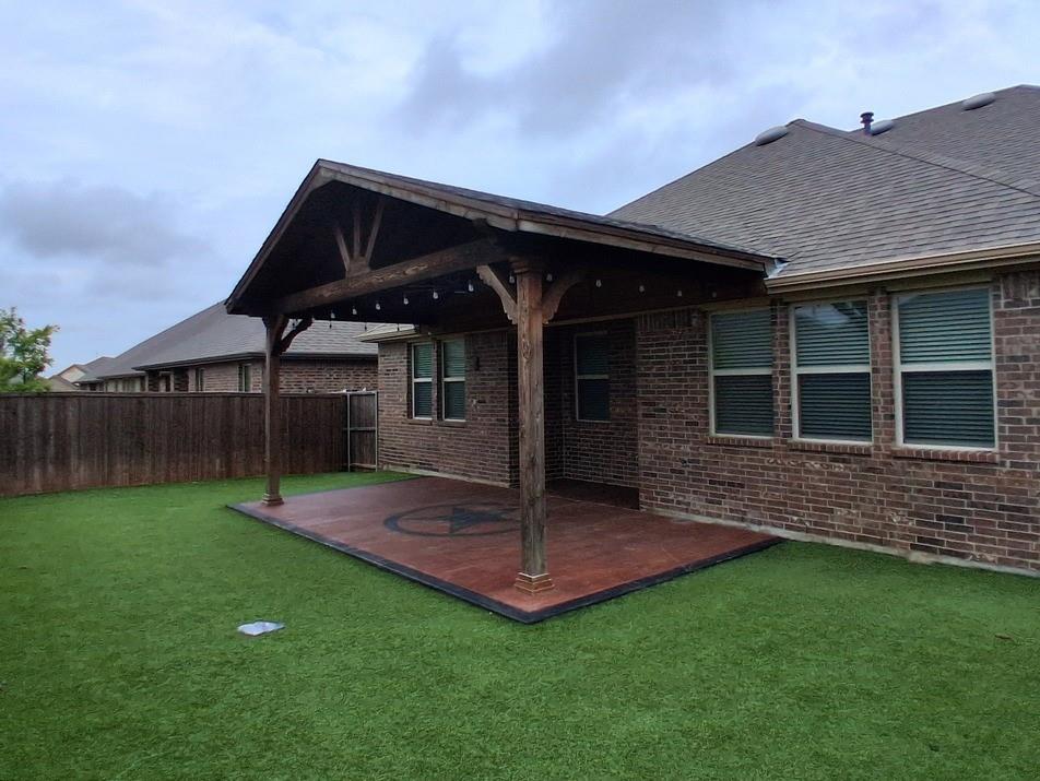 141 Colony Way Fate, TX 75189 - Photo 19 of 20 a front view of a house with a garden