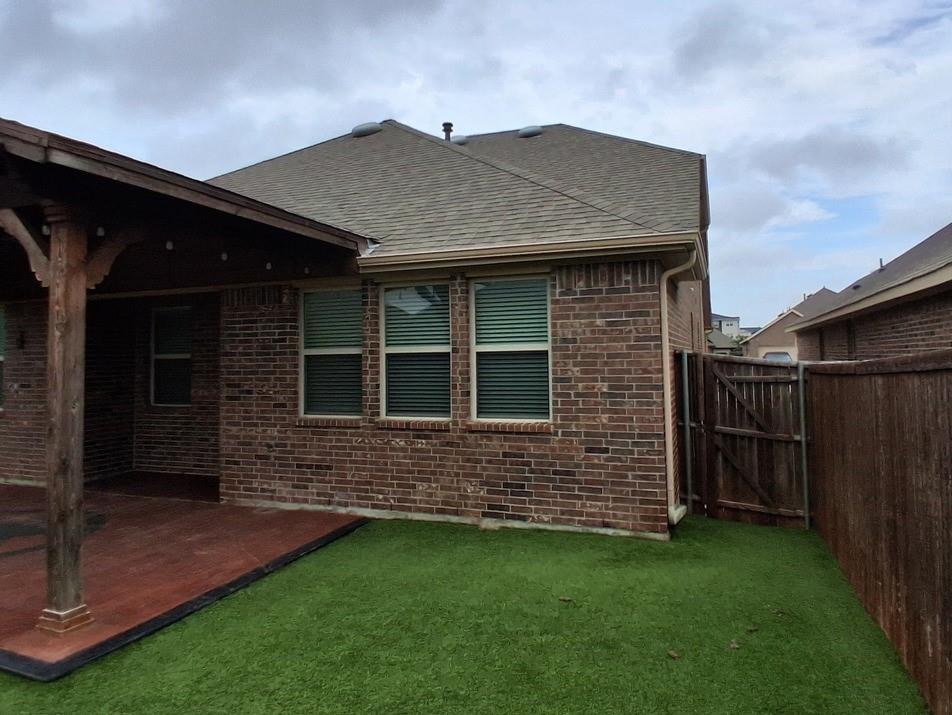 141 Colony Way Fate, TX 75189 - Photo 20 of 20 a brick house with a small yard