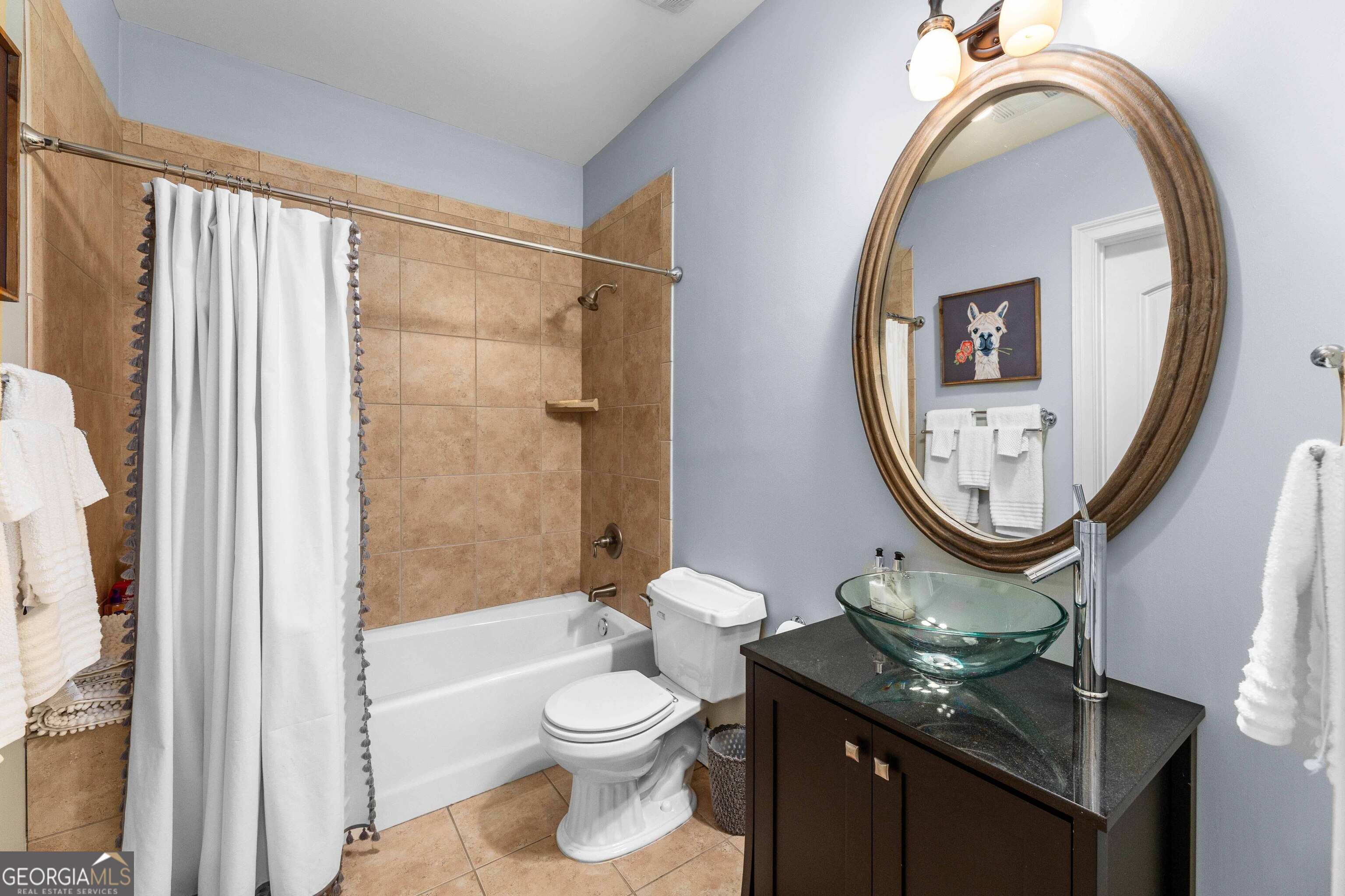 2000 Poplar Drive Columbus, GA 31906 - Photo 25 of 33 a bathroom with a toilet a sink and a mirror