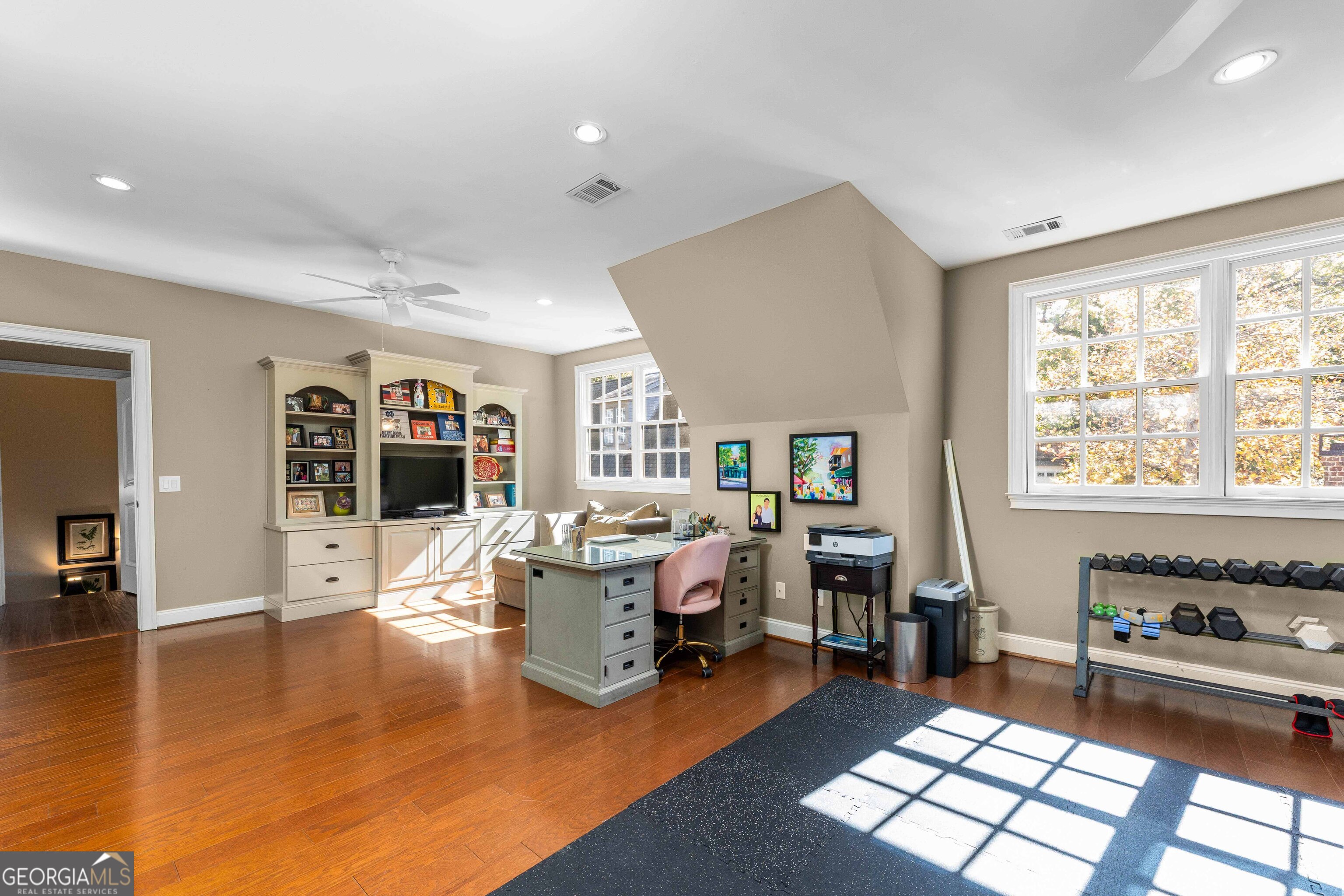 2000 Poplar Drive Columbus, GA 31906 - Photo 26 of 33 a living room with furniture and a flat screen tv with wooden floor
