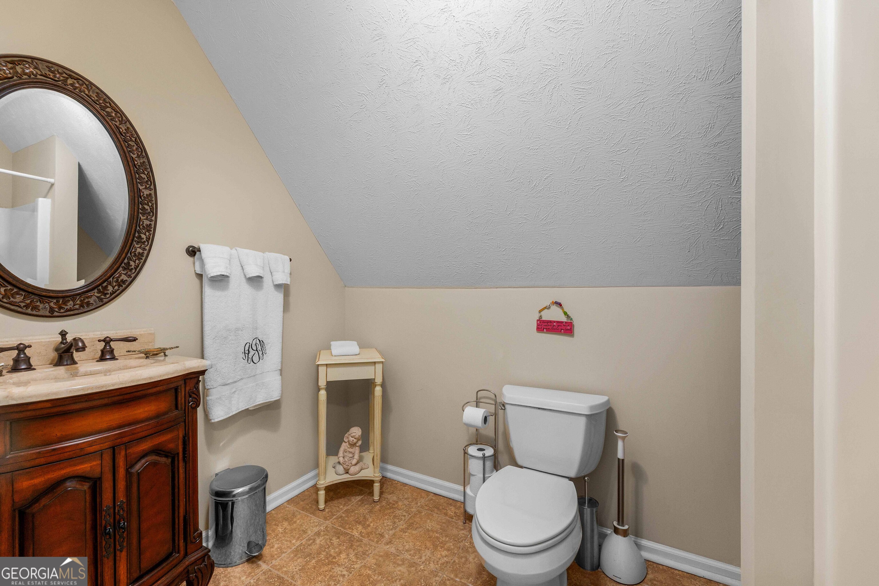 2000 Poplar Drive Columbus, GA 31906 - Photo 33 of 33 a bathroom with a toilet sink vanity mirror and vanity