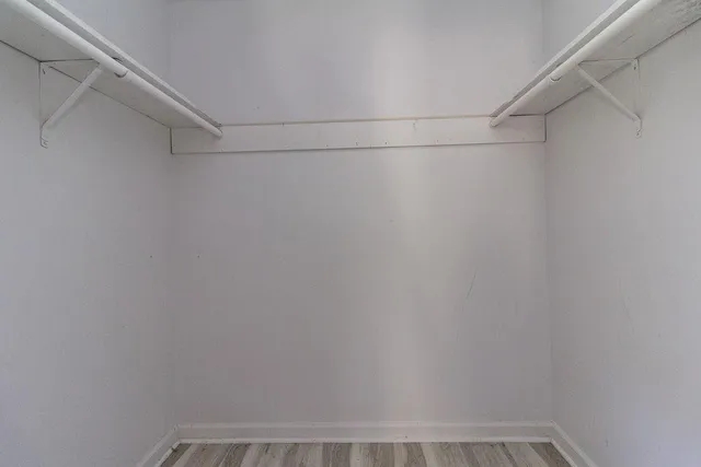 a view of a room with shelf on the wall